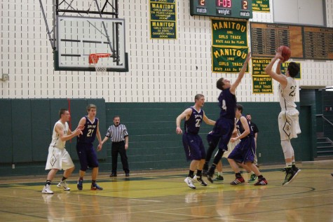 Lucas Rodholm goes for three while Danny McGee helps guard. 