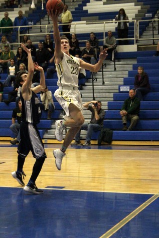 Lucas Rodholm goes up for a layup against James Irwin at Districts. The Mustangs won this game and went on to win the next, which gave them the league title. They will play at the Regional Tournament on Friday, March 4.