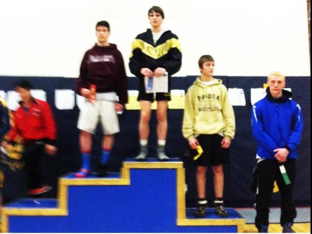 Senior Ryan Carpenter stands on the first place podium during the Regional Tournament ceremonies.