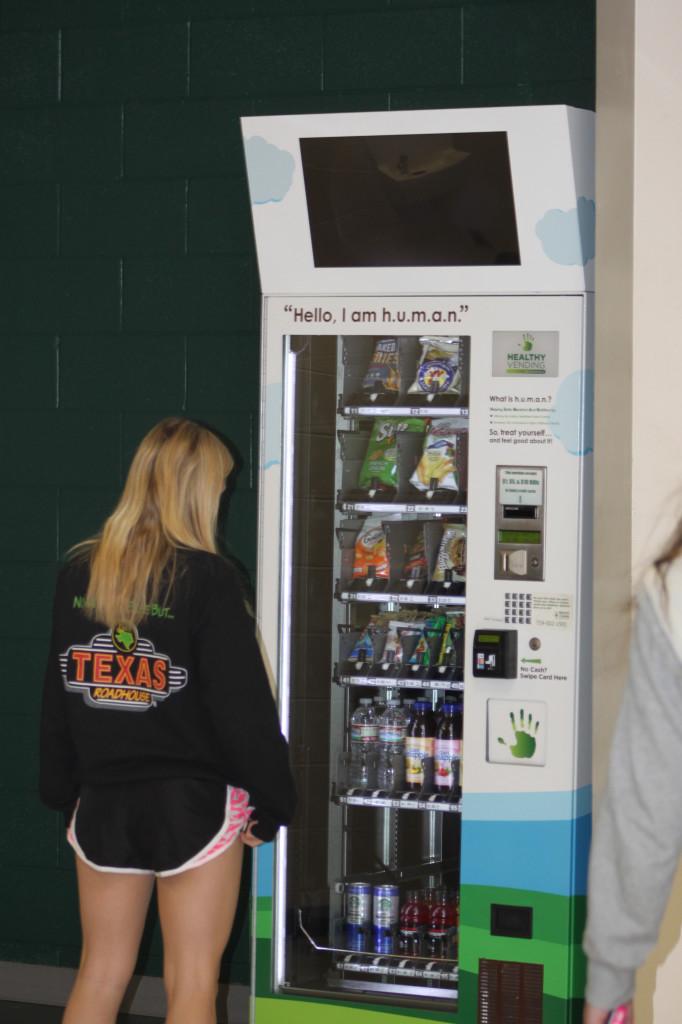 Junior Hali Krause staring into the glorious abyss that is the
h.u.m.a.n. vending machine