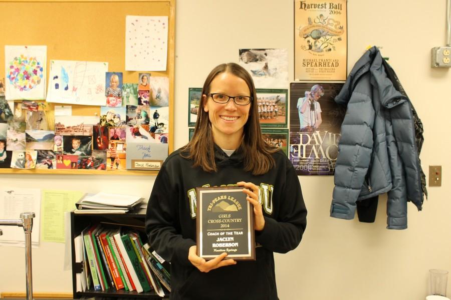 Mrs. Roberson holding her coach of the year award.