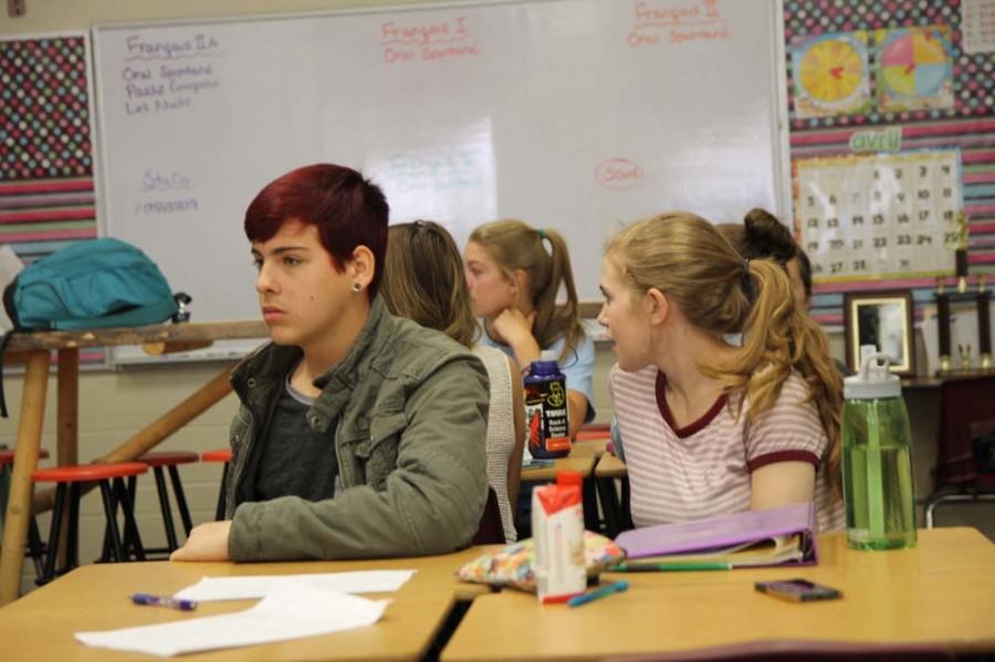 Brennan McLaren (10) and Rebekah Shaw (12) listen to an on-the-fly motion about the dress code in Student Council. Recently, the council has decided to look at re-writing the dress code to make it more reasonable and accepting for all genders. 