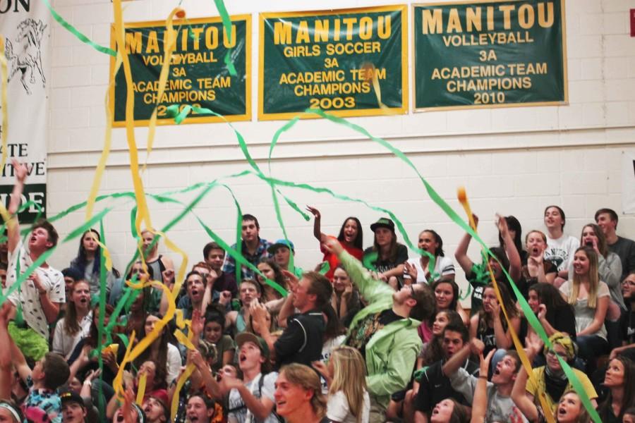 The senior class shows their school pride by throwing green and gold streamers. The goal was for the senior class to show the most spirit.