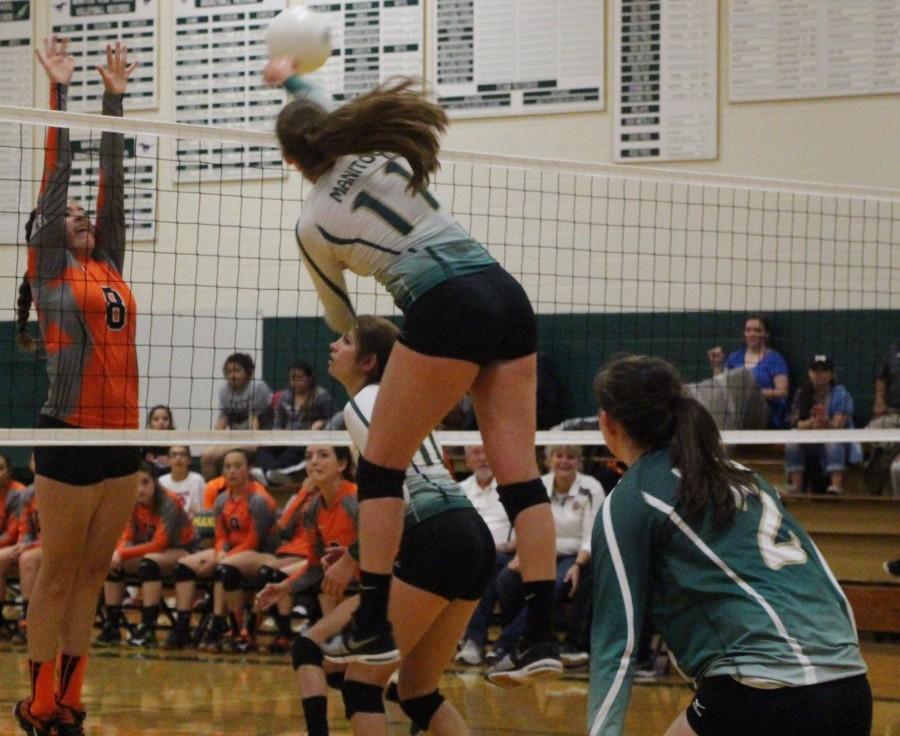 (12) Katie Mckiel spikes a ball against La Junta. Mckiel recently committed to University of Tampa who are reigning Division 2 champions.