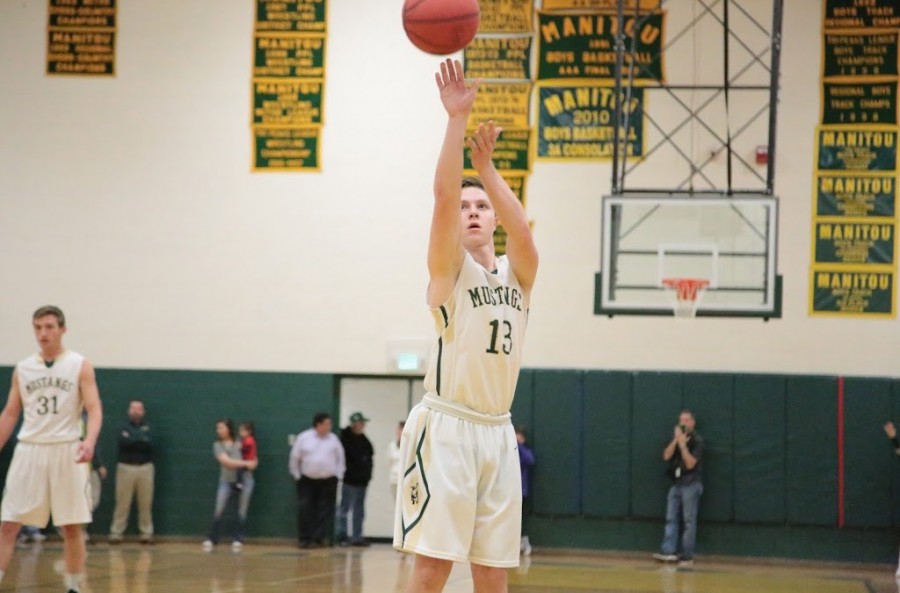 Davyn Adamscheck (12) takes one of his many free throws during the game.