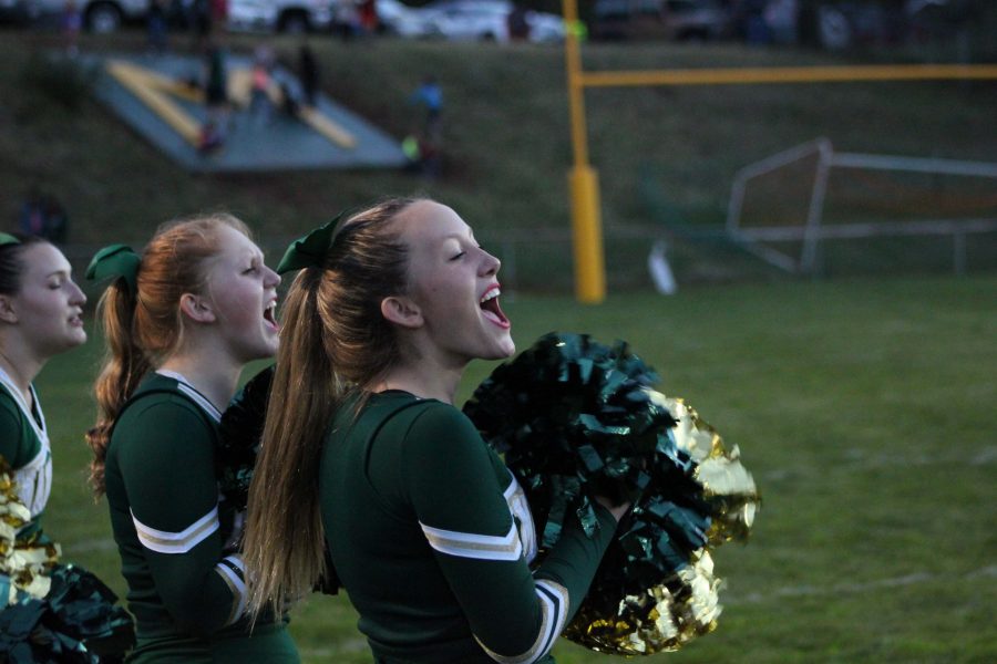 Ella Slater (9) cheers on the Mustangs at a home game against the Saint Marys Pirates. 