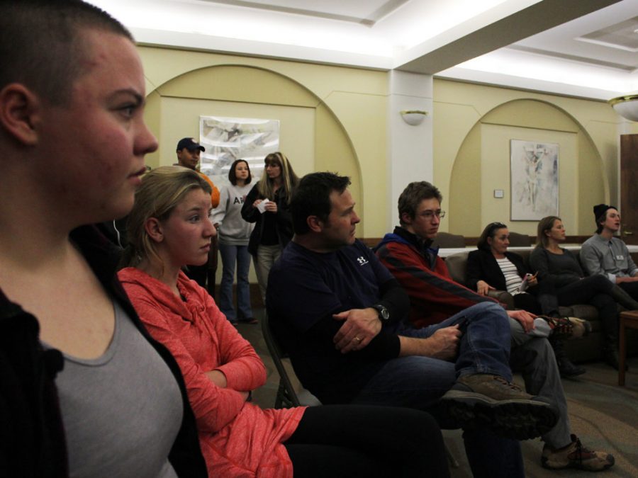 (from left to right) Maya West (11), Maddie Butts (11), Mark Searle, and Tyler Jungbauer (11) listen to a group discussion regarding takeaways from Urban Peaks poverty simulation. During the simulation, these individuals all played the part of an 85 year-old homeless woman who had tasks to complete an errands to run during each 15-minute week.