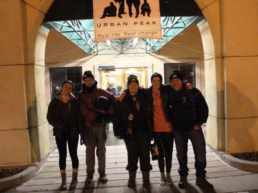(from left to right) MSHS students Aubrey Hall (11), Tyler Jungbauer (11), Maya West (11) and GSTA advisor Mark Searle pose for a photo beneath the archway of Colorado Springs First United Methodist Church, where the event was held. Students from Manitou Springs High School have participated in the night out for the past three years,  but participation in the event was first spearheaded by the GSTA last year.