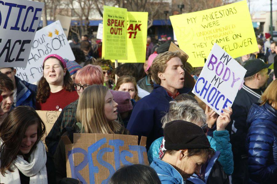 Aubrey Hall (11) marches with the crowd in Colorado Springs. Theres still so much to do, but the marches were an amazing way to send a message on Trumps first day in office, she said. Aubrey is a member of Manitous student council, as well as the Co-President of the schools Gay, Straight Transgender Alliance with Lily Reavis. 