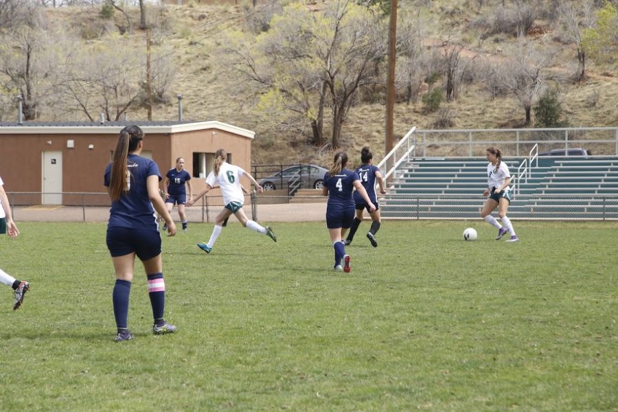 Junior Brooklyn Mack takes control of the ball. Mack has played soccer all three years for Manitou.