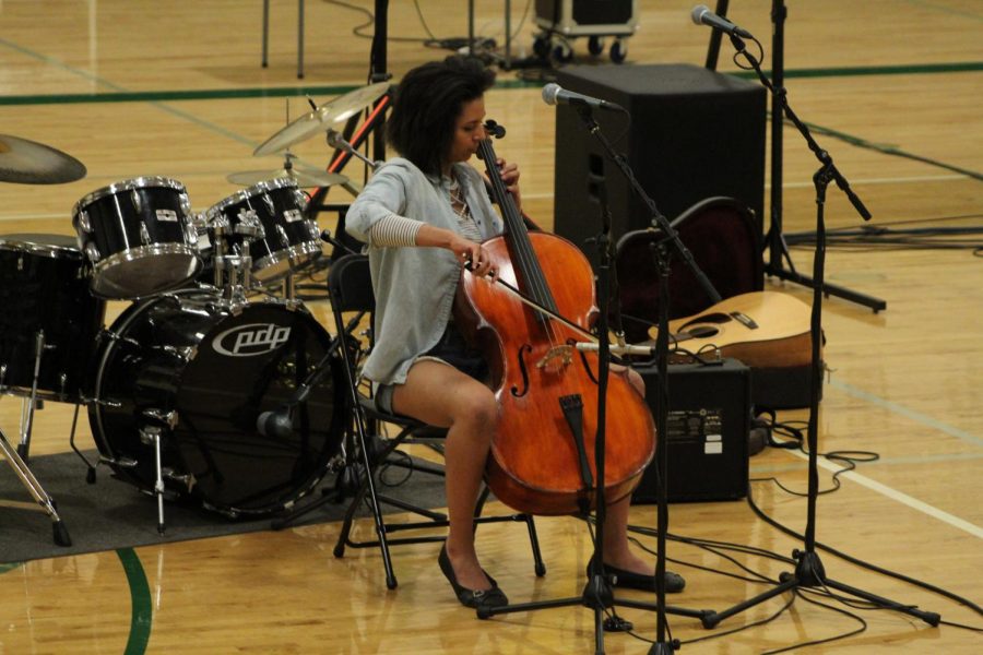 Talia Traxler (10) plays her instrument infront of the student body. 