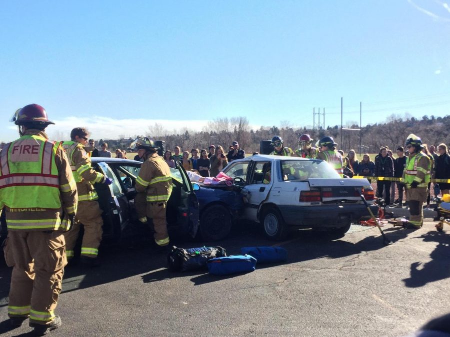 A devastating car crash captures students attention as first responders attempt to pull a “lifeless” Caleb Allen (9) from the wreck. Allen and his older brother participated in this demonstration to educate classmates on how bad distracted driving can be. 