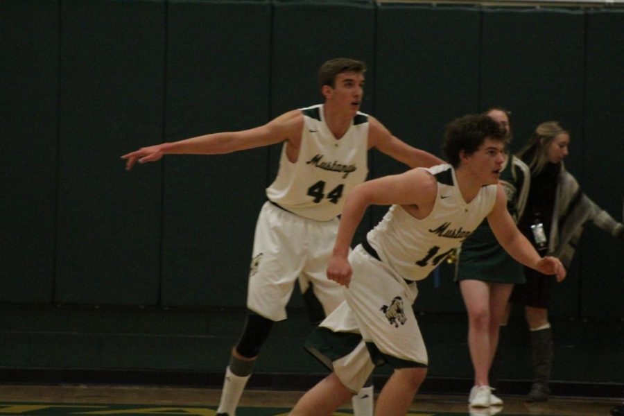 Senior players Hunter Zentz and Zach Perry-Perkins play defense in a game agains CSCS.
