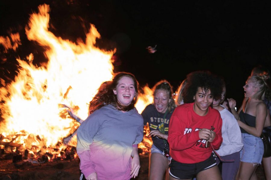 The winning photo Sophie McKeown (10) submitted to Popup XQ Magazine features MSHS seniors Ava Spangler, Allison Wilson, Maya Alexander, and Olivia McKenna. The photo was taken during the 2018 Homecoming Bonfire. 