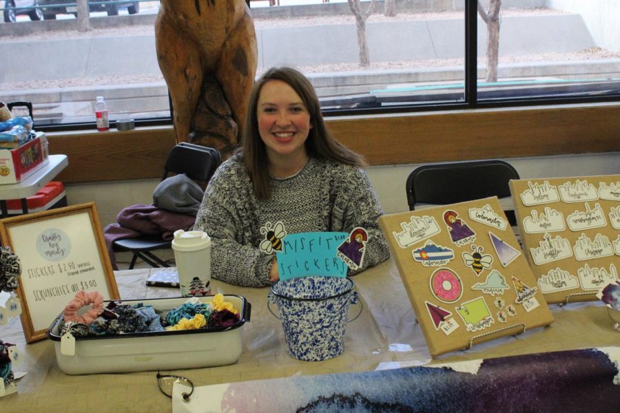 Madeline Davis (12) sits at her CraftzbyMadz booth. At the Craft Fair, she sold stickers and scrunchies that she made herself.