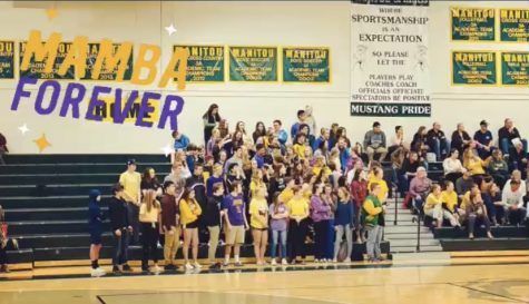 The Mustangs crowd wore their gold and purple clothing while cheering for the boys basketball team.