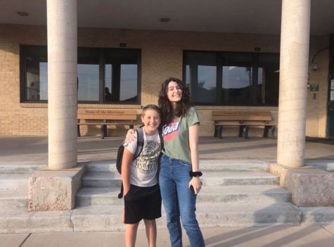 Mariam Gachechiladze (12) poses with her host brother, Ben Perkins, on the first day of school.