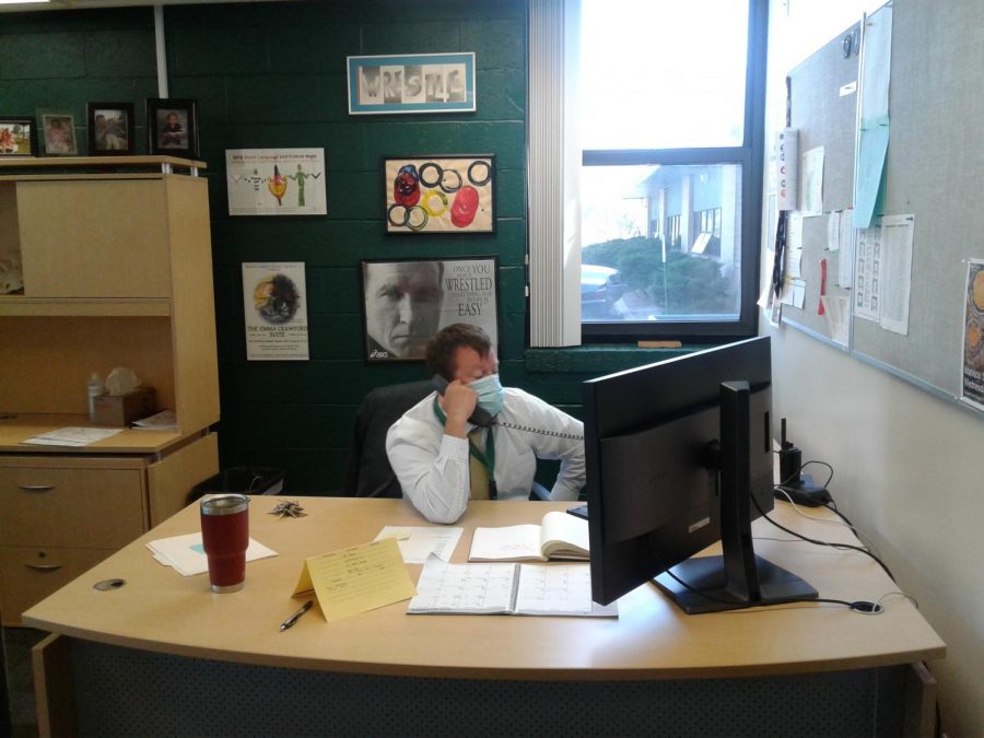Mr. Hull works from his desk Tuesday triaging the new remote learning schedule.