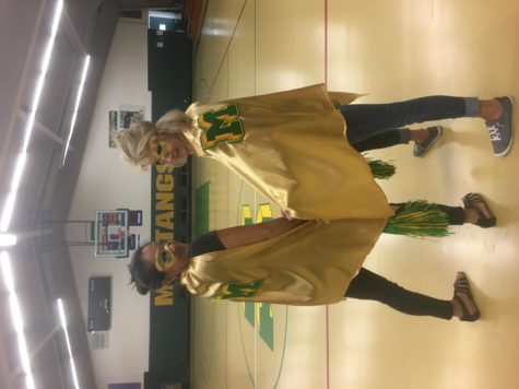 Angie Glass  and Wendy Skokan dressed as superheroes for a student assembly in 2019. 