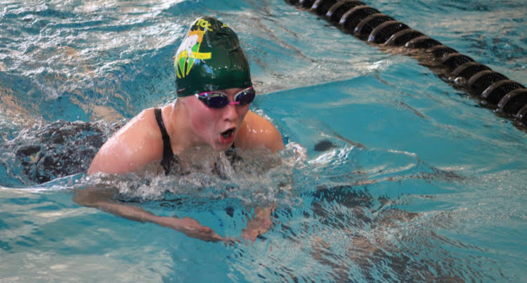Aidan Coté (12) races breaststroke for the MSHS Girls Swim & Dive team during the winter high school sports season.  Coté trains year round on her club team, the Colorado Torpedoes.