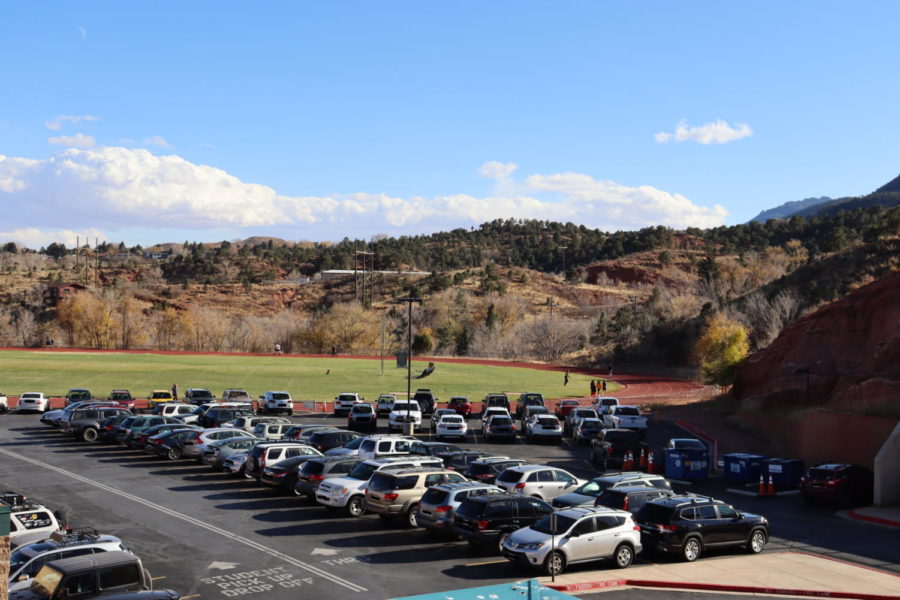 Manitou+Springs+High+School+parking+lot+filled+with+student+and+staff+vehicles.