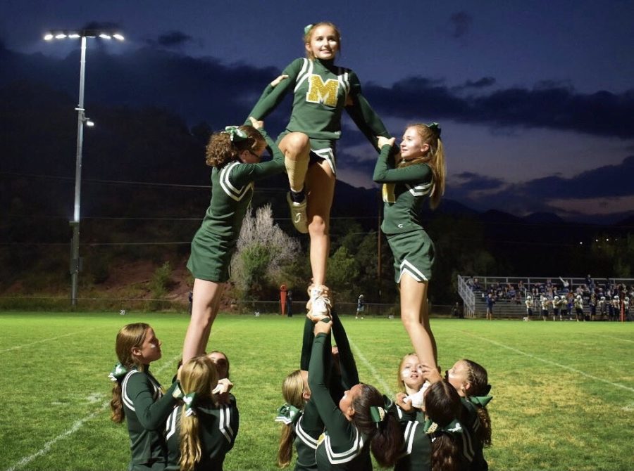 This year’s cheer team performs a pyramid, with junior Grace McCumber on top. A pyramid is a perfect representation of teamwork as it requires every single member of the team to come together. The specific skill being performed is called a lib, which is something that the team was never able to do last year but now is incorporated into their game day stunts and competition routine.