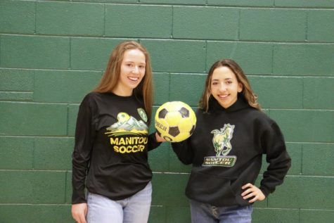 Team leaders Madrid Mack (11) and Abigail Parker (12) hold a soccer ball together in the MSHS gym to represent the teams new start. 