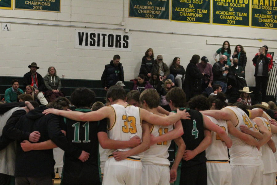 Manitou Springs Boys Basketball team huddle with St. Marys basketball team after rivalry game on January 19th. Although we ended up losing this game, the huddle helped us end it on a positive note with the St. Marys players, Ethan Boren (12).