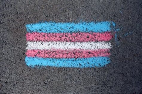 The Sunday before the planned protest, parents chalked the student parking lot with pride flags.