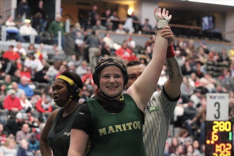 Despite only wrestling for two years, Hannah Hollick (12) clinched a fourth place victory at State.