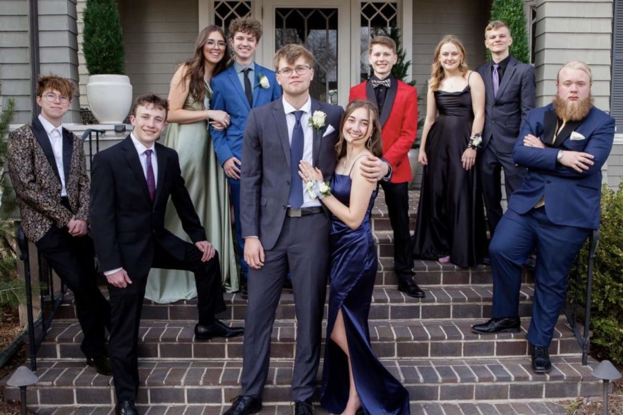 Henry White, Atticus Baker, Audrey Harrell, Finian Dufford, Anton Akse, Tallulah Bates, Colten Talbot, Lindsey Hinshaw, Logan Abeel and Connor OBrien take pictures together before the 2022 prom dance.