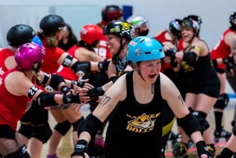 Senior Zora Beezley celebrates a victory with her team, The Pikes Peak Derby Dames (PPDD).