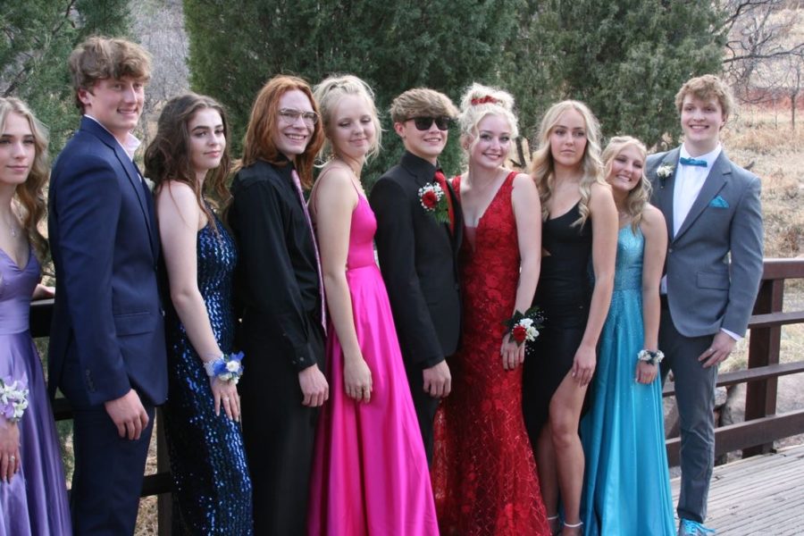 Caylani Falbo, Jesse Jorstad, Piper Larsen, Paige Harrison, Grayer Whipkey, Adele Goodwin, Serena Holvenstot, Claire Kisielnicki and Nathan Haas, take pictures with their dates in Crystal Hills before the 2022 prom dance.