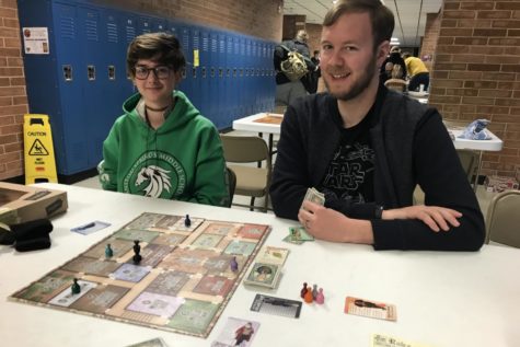 Zach Brown plays Kill Doctor Lucky with junior Lilly Noon at Game Con 2022. Brown co-sponsored Game Club with Mr. Gillard this year.
