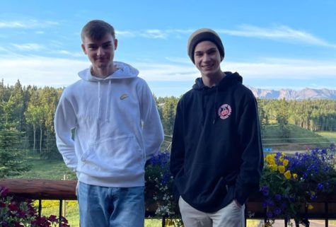 Lukas Merz and his host brother Charlie Morgan (12) pose on their porch in front of Pikes Peak.