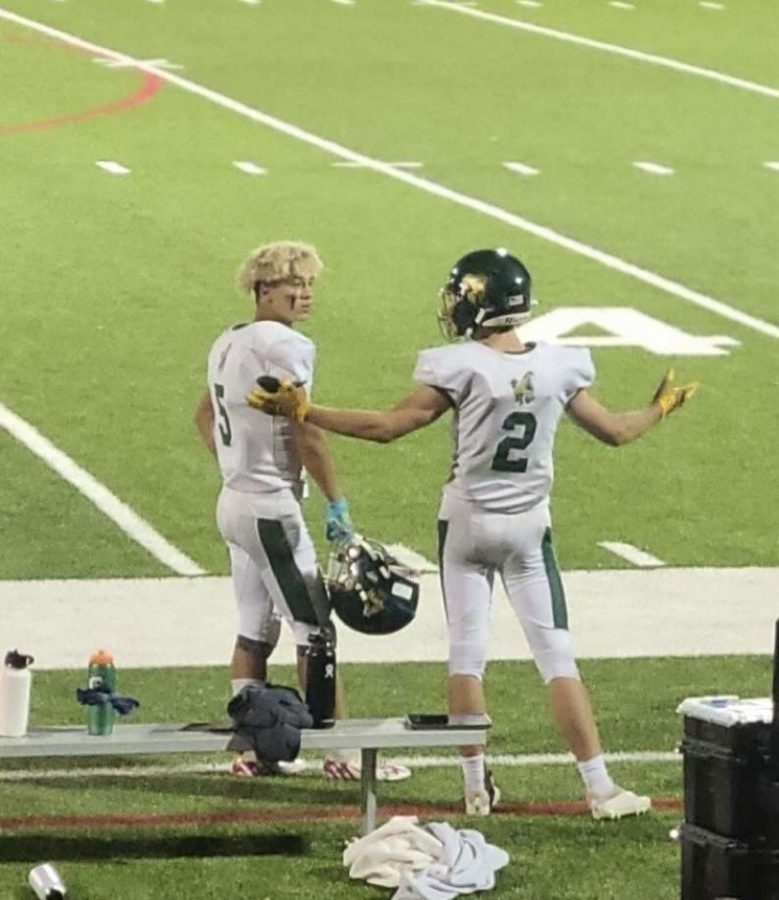 Tyler+Maloney+%235+and+Evan+Scherr+%232+after+scoring+a+combined+5+touchdowns+on+the+sideline+after+winning+46-12+against+Rocky+Ford+High+School.