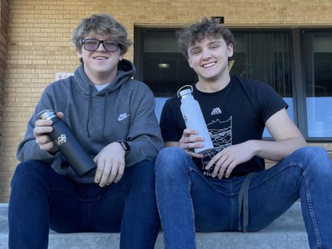 Matthew Barton (12) and Ethan Orr (12) hold the water bottles that started their successful business.