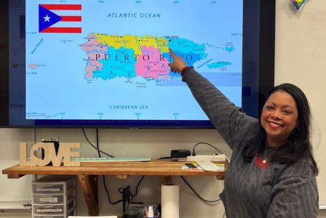 Ingrid Perez points to her home country of Puerto Rico in her classroom. In 2016, Perez moved from Puerto Rico to Colorado for her husband to pick up a job opportunity.