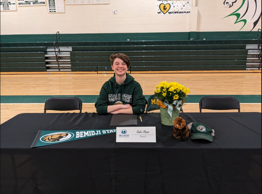 Sadie House poses with her Bemidji State University regalia. Signing Day is a tradition at the high school to celebrate students signing for sports and band at different universities. I was honored and excited to participate. A lot of people don’t realize that like sports, musicianship is something that requires training and practice outside of school