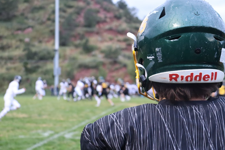 Ben Perkins (11) watches his team in action at the first home football game on Friday night at Richardson Field.