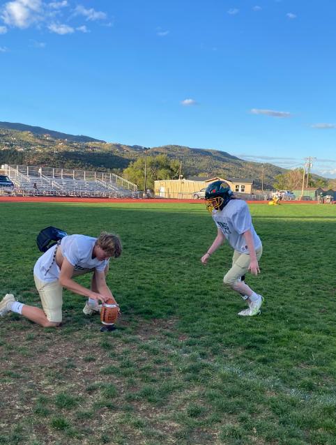 Kate Johnson and Nate Gentzel(12) practice point after touchdown attempts at the end of practice. 