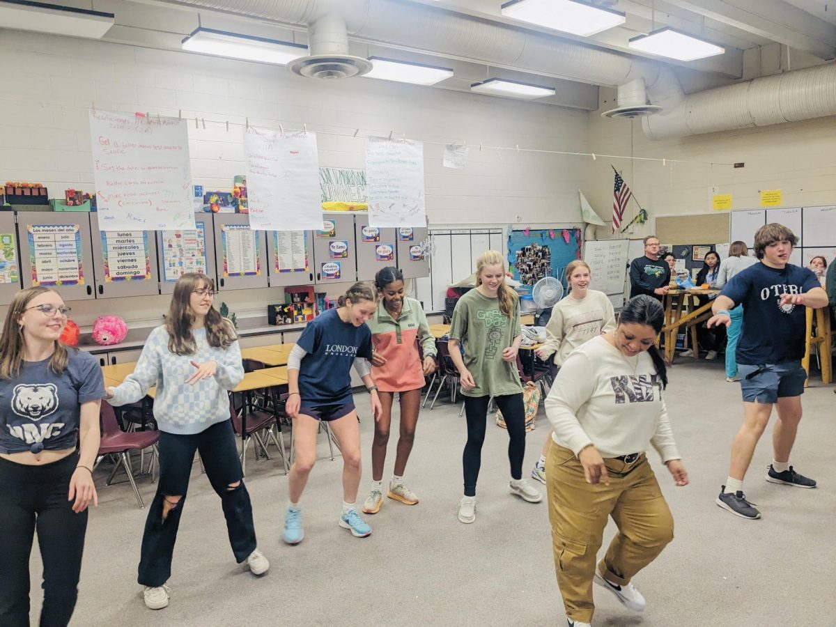 Ingrid Perez teaches students basic steps of salsa dancing.