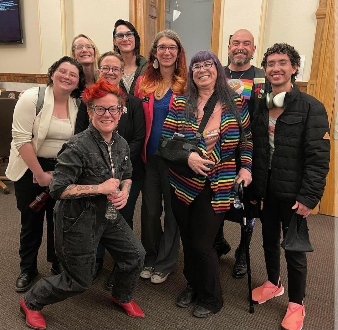 Meghan Taylor (12) celebrates with the rest of the COYAC members in the Colorado House of Representatives after the hearing of HB24-1039: Non-Legal Name Changes and HB24-1040: Gender-Affirming Health-Care Provider Study. The bills were drafted all of the legal language was put down by the Legislative Council, because our job as COYAC members, is really to create proposals of things that we see you going through our job is not to write the legal language because, unfortunately, something that the COYAC director has reminded me many times, Taylor said. When I called her at like 9:30pm asking her for help was ‘Meghan you do not have a law degree’. Unfortunately, I do not. Im still in high school. Its really a pain. I wish I did.