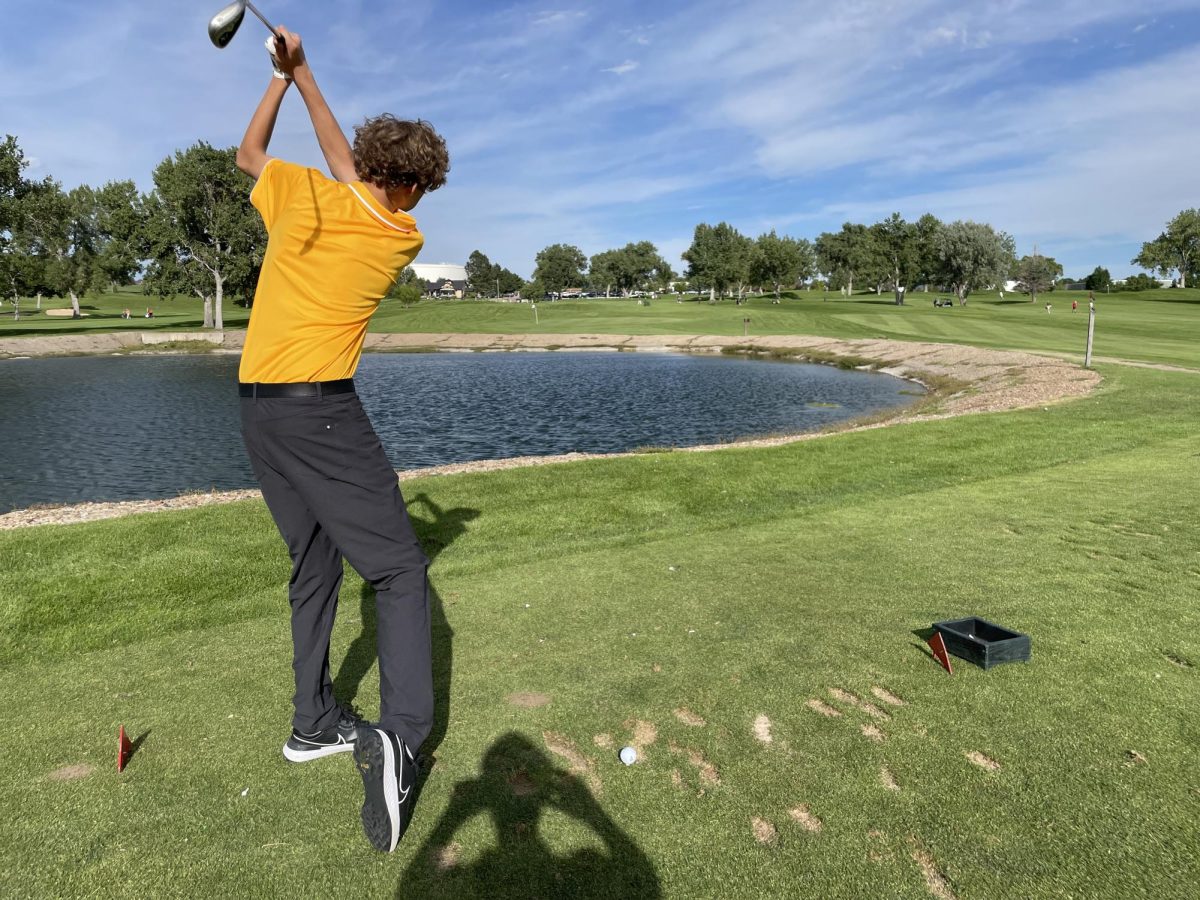 Mycah Weeks (10) practices his swing to hit the golf ball across the lake, on Wednesday Aug. 28. The JV golf team and coach Lutz went to a tournament at Cherokee Ridge and placed 4th out of 9 teams.