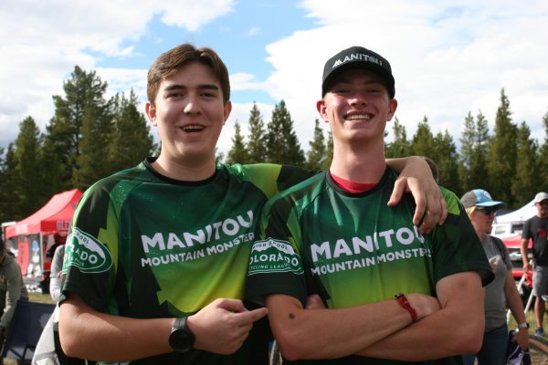 Cedric Ebler (12) and Devon Harris (12) smile together after awards are announced. On Saturday, Aug. 23, the mountain bike team had their first race, the Cloud City Challenge, in Leadville.