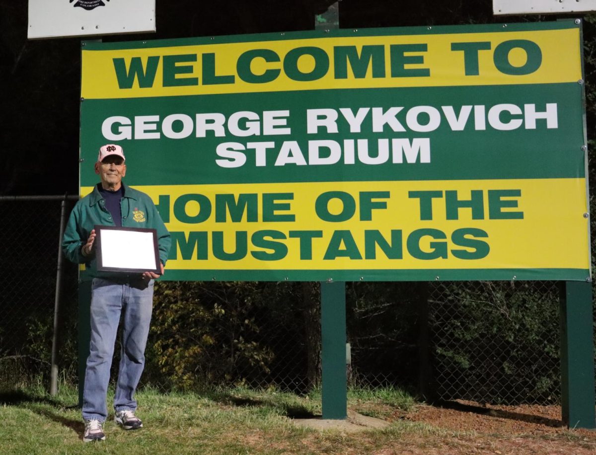 To commemorate the field being renamed after Rykovich he was awarded a plaque and there is a new sign underneath the scoreboard. 