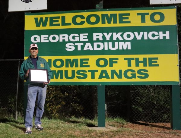 To commemorate the field being renamed after Rykovich he was awarded a plaque and there is a new sign underneath the scoreboard. 