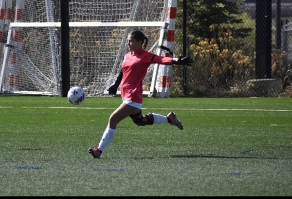 Nici Sharon(12) kicks a soccer ball during the girls soccer season of her junior year during a game. Nici Sharon has found that being goalie has grown on her over the years.