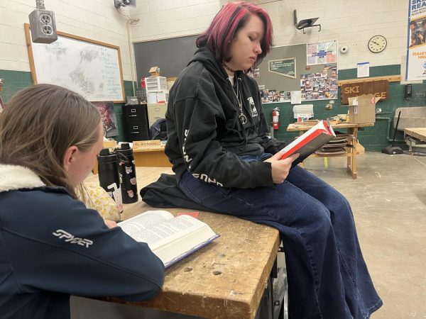 Brooke Ferguson (11) and Miranda Chasteen (11) read to help with their seasonal depression.