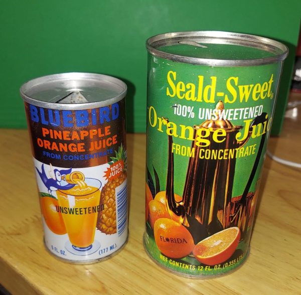 Vintage orange juice cans found in confined space, dated 1971.